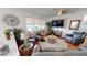 Spacious living area with comfortable seating and a large TV at 10034 Winding River Rd, Punta Gorda, FL 33950