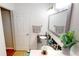 Clean bathroom with a double vanity and large mirror at 10034 Winding River Rd, Punta Gorda, FL 33950