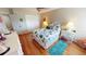 Guest bedroom with hardwood floors and a full-size bed at 10034 Winding River Rd, Punta Gorda, FL 33950