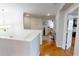 Upstairs hallway with hardwood floors and access to bedrooms at 10034 Winding River Rd, Punta Gorda, FL 33950