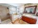 Large bathroom with double vanity, soaking tub, and shower at 10034 Winding River Rd, Punta Gorda, FL 33950