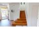 Elegant staircase with hardwood flooring at 10034 Winding River Rd, Punta Gorda, FL 33950