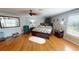 Comfortable bedroom with hardwood floors and large window at 10034 Winding River Rd, Punta Gorda, FL 33950