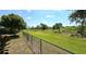 Chain link fence encloses the large grassy backyard at 10034 Winding River Rd, Punta Gorda, FL 33950