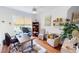 Home office with built-in shelving and hardwood floors at 10034 Winding River Rd, Punta Gorda, FL 33950
