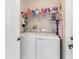 Convenient laundry room with washer, dryer, and overhead shelving at 4530 Irdell Ter, North Port, FL 34288