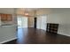 Dining area with dark wood-look floors and an elegant chandelier at 4530 Irdell Ter, North Port, FL 34288