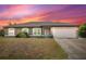 House exterior showcasing front entrance and garage at 4530 Irdell Ter, North Port, FL 34288