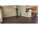 Bright living room with dark wood-look tile floors and ceiling fan at 4530 Irdell Ter, North Port, FL 34288