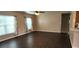 Spacious living room featuring dark tile floors and large windows at 4530 Irdell Ter, North Port, FL 34288