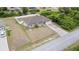 House with driveway, fenced yard, and neighborhood view at 4530 Irdell Ter, North Port, FL 34288