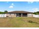 Large backyard with screened porch, swing set, and privacy fence at 4530 Irdell Ter, North Port, FL 34288