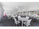 Community room with tables and chairs for gatherings at 26485 Rampart Blvd # D3, Punta Gorda, FL 33983