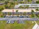 Aerial view showing condo building location and surrounding parking at 26485 Rampart Blvd # D3, Punta Gorda, FL 33983