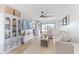 Spacious living room with L-shaped sofa, decorative accents, and hardwood floors at 26485 Rampart Blvd # D3, Punta Gorda, FL 33983