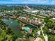 Expansive aerial view featuring a residential community with lakes, pools, and lush greenery at 5685 Ashton Lake Dr # 2, Sarasota, FL 34231