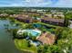 Aerial shot showcasing a community's pool, lakes, landscaping, and residential buildings at 5685 Ashton Lake Dr # 2, Sarasota, FL 34231