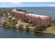 Aerial view of waterfront community, showcasing building and landscaping at 85 Vivante Blvd # 8531, Punta Gorda, FL 33950