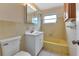 Bathroom with yellow tub and white vanity at 3365 Westlund Ter, Port Charlotte, FL 33952