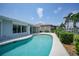 Relaxing kidney-shaped pool in the backyard at 830 Napoli Ln, Punta Gorda, FL 33950