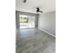 Bedroom with tile floors and sliding doors to the pool at 75 Annapolis Ln, Rotonda West, FL 33947