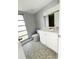 Bathroom with vanity, toilet, and tile floor at 75 Annapolis Ln, Rotonda West, FL 33947