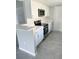 Updated kitchen with stainless steel appliances and white cabinets at 75 Annapolis Ln, Rotonda West, FL 33947