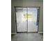 View of a patio through sliding glass doors at 75 Annapolis Ln, Rotonda West, FL 33947