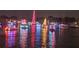 Boat parade at night with colorful lights at 1060 San Mateo Dr, Punta Gorda, FL 33950