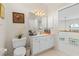 Bathroom with toilet, vanity, and view of upper landing at 1060 San Mateo Dr, Punta Gorda, FL 33950