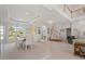 Bright dining room with glass table and chairs, offering views to backyard at 1060 San Mateo Dr, Punta Gorda, FL 33950