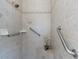 Walk-in shower with grab bars and neutral tile at 1060 San Mateo Dr, Punta Gorda, FL 33950
