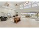 Spacious living room with high ceilings, fireplace and access to pool at 1060 San Mateo Dr, Punta Gorda, FL 33950
