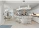 White kitchen with breakfast bar, ample counter space, and stainless steel appliances at 1060 San Mateo Dr, Punta Gorda, FL 33950