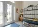 Bright entryway with glass door and decorative shelving unit at 1060 San Mateo Dr, Punta Gorda, FL 33950