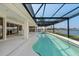 Inviting pool with a covered lanai and serene water views at 1060 San Mateo Dr, Punta Gorda, FL 33950