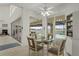 Bright breakfast nook with glass-top table and chairs, overlooking canal at 1060 San Mateo Dr, Punta Gorda, FL 33950
