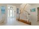 Elegant curved staircase with wooden railings and carpet at 1060 San Mateo Dr, Punta Gorda, FL 33950