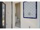 Small, clean bathroom with tiled shower and patterned decor at 1060 San Mateo Dr, Punta Gorda, FL 33950