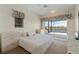 Bedroom with water views and access to balcony at 1060 San Mateo Dr, Punta Gorda, FL 33950