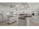 Spacious kitchen with island, white cabinets, and water views at 1060 San Mateo Dr, Punta Gorda, FL 33950