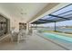 Relaxing pool and spa area with covered lanai, offering water views at 1060 San Mateo Dr, Punta Gorda, FL 33950