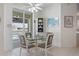 Breakfast nook with glass table and chairs, offering water and pool views at 1060 San Mateo Dr, Punta Gorda, FL 33950