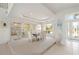 Bright dining room with glass cabinets and seating for six at 1060 San Mateo Dr, Punta Gorda, FL 33950