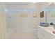Clean bathroom with tub, shower, and double vanity at 1060 San Mateo Dr, Punta Gorda, FL 33950