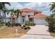 Two-story waterfront home with tile roof and landscaped yard at 1060 San Mateo Dr, Punta Gorda, FL 33950
