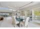 Spacious dining area with glass table and chairs, adjacent to kitchen and water views at 1060 San Mateo Dr, Punta Gorda, FL 33950