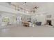 Spacious living room with high ceilings and a fireplace at 1060 San Mateo Dr, Punta Gorda, FL 33950