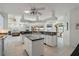 Large kitchen with island, breakfast bar, and views of canal and pool at 1060 San Mateo Dr, Punta Gorda, FL 33950