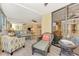 Relaxing lanai with wicker furniture and sliding glass doors at 8750 Midnight Pass Rd # 202, Sarasota, FL 34242